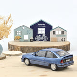Opel Kadett GSi 1987 Light Blue met 1:18 - 200pcs