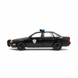 Ford Taurus noir avec figurine Robocop 1986 1/24