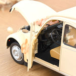 Voiture miniature Norev Citroën 2CV 1986 beige mariage avec capot ouvert et décoration florale sur le tableau de bord