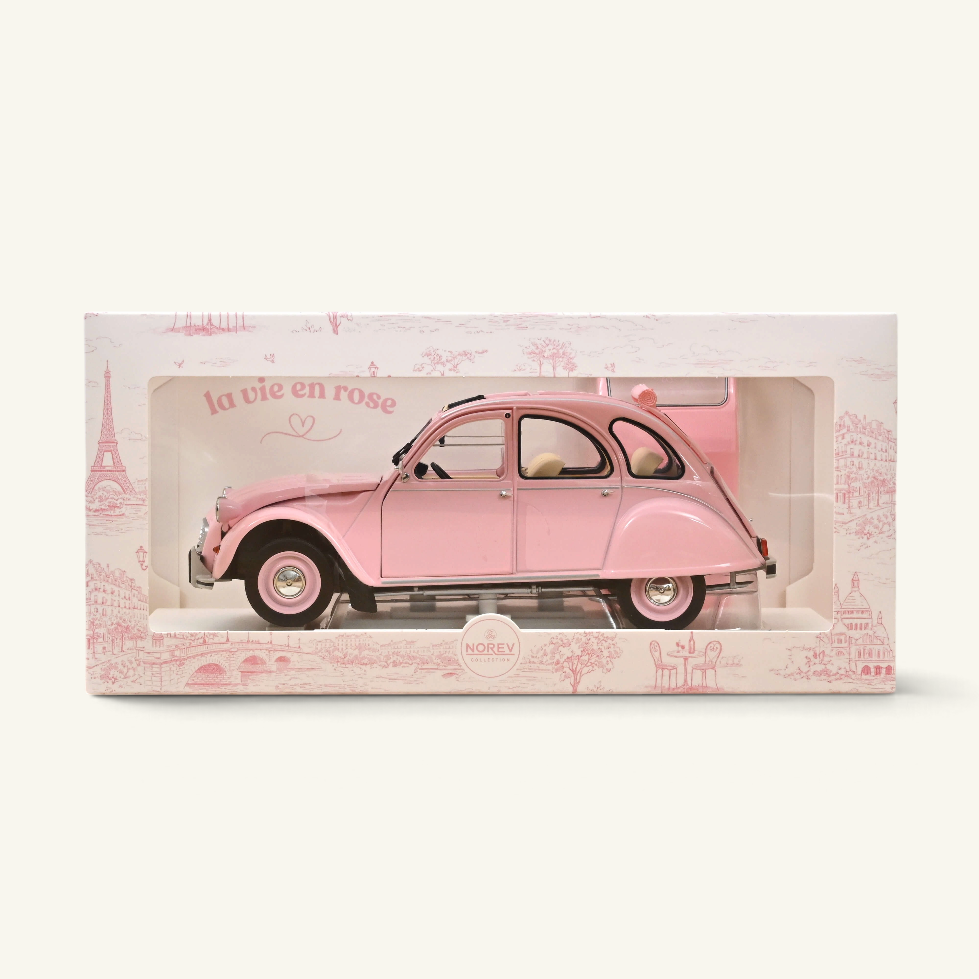 Voiture miniature Norev Citroën 2CV 1986 Paris mon amour rose poudré dans sa boîte décorée sur le thème de Paris